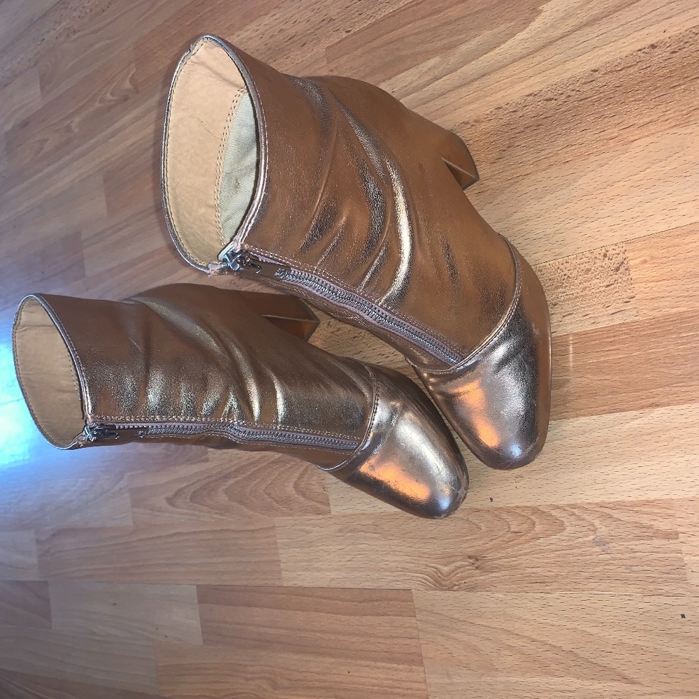 Metallic rose gold ankle booties with front zipper